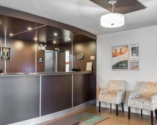 a salon with two chairs and a mirror at Quality Inn Mont-Laurier in Mont-Laurier