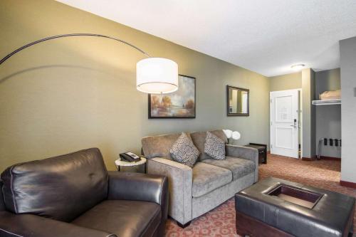 a living room with a couch and a chair at Quality Hotel in Drumheller