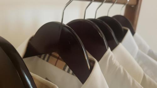 a bunch of hats are hanging on a rack at B&B re apartments Palazzo Muscati in Molfetta