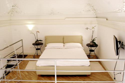 Ένα ή περισσότερα κρεβάτια σε δωμάτιο στο Ognina Residence