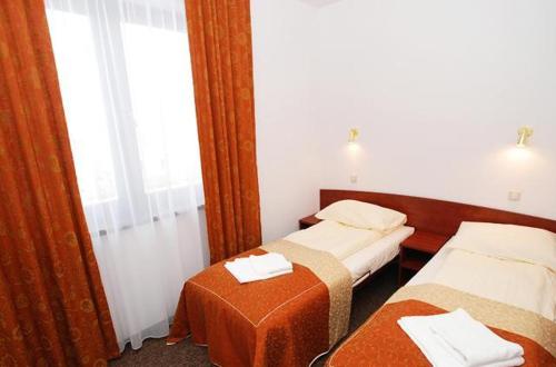 Postel nebo postele na pokoji v ubytování Orka
