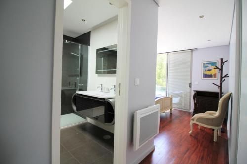 a bathroom with a sink and a mirror at Golf Course - Luxurious Flat T3 - Ponte de Lima in Ponte de Lima