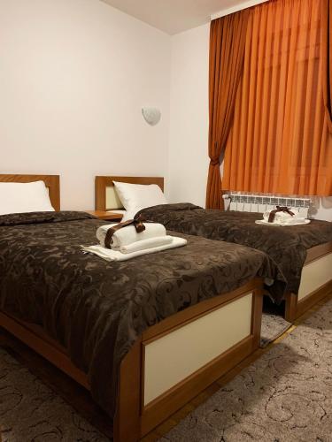 Ένα ή περισσότερα κρεβάτια σε δωμάτιο στο Apartments Nella