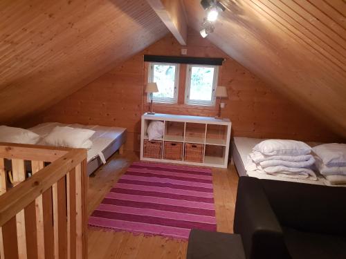Postel nebo postele na pokoji v ubytování Örnatorpet Ullared