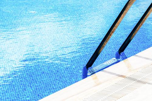 a swimming pool with two oars in the water at 4reasons hotel + bistro | 12+ in Yalıkavak