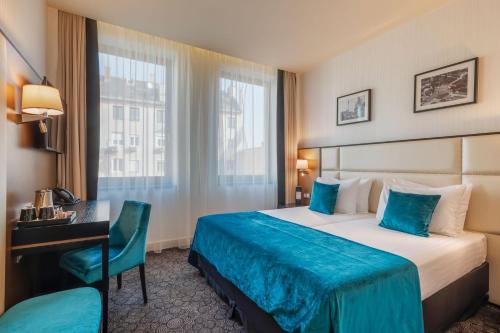 Posteľ alebo postele v izbe v ubytovaní Eurostars Danube Budapest
