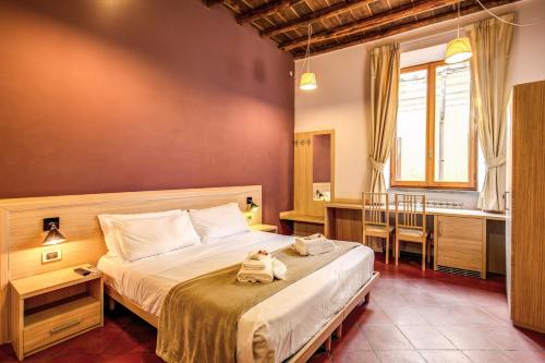 a bedroom with a bed with two stuffed animals on it at Guest House o Affittacamere Magenta Fico 2 in Rome