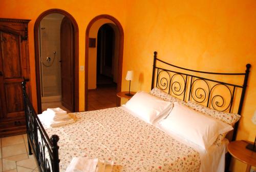 Postel nebo postele na pokoji v ubytování B&B MilleQuattrocento