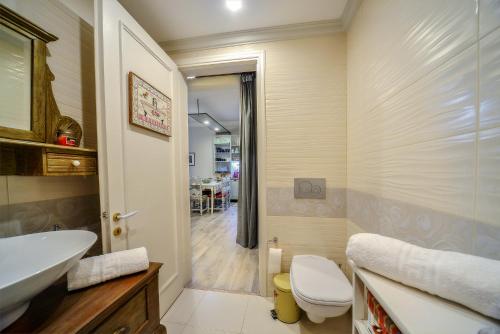 a bathroom with a toilet and a sink at Contessina Apt. in Corfu Town