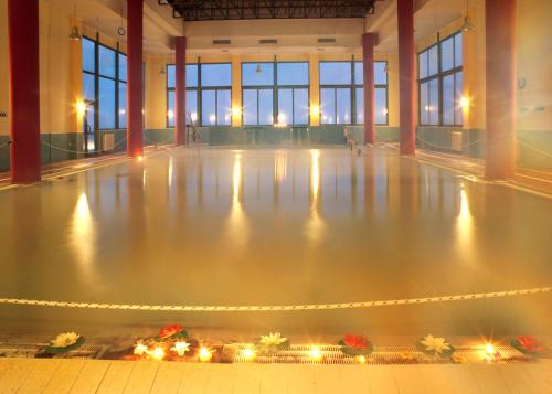 an empty dance floor in a large building with lights at Palamidi in Agia Paraskevi