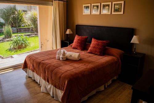 Ένα ή περισσότερα κρεβάτια σε δωμάτιο στο Posada y spa Las Golondrinas