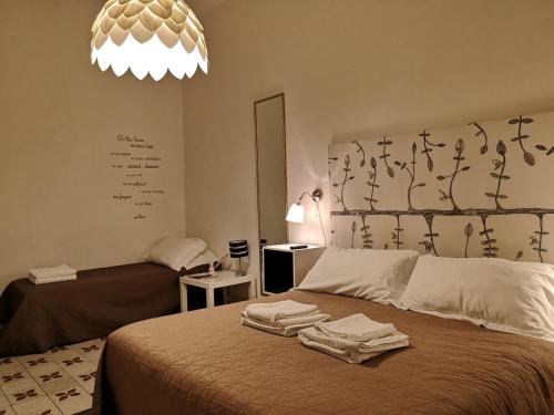 
Ein Bett oder Betten in einem Zimmer der Unterkunft Domò Vaticano Guest House
