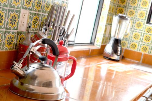 a tea kettle on a counter in a kitchen at The House of Cinema in Guanajuato