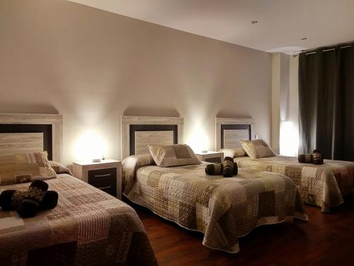 En eller flere senge i et værelse på Casa Rural El Caño