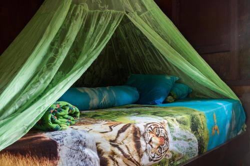 Voodi või voodid majutusasutuse Rain Forest Guest House toas