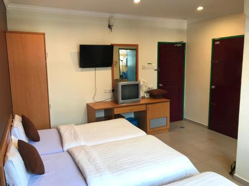 TV a/nebo společenská místnost v ubytování Kangsar Hotel