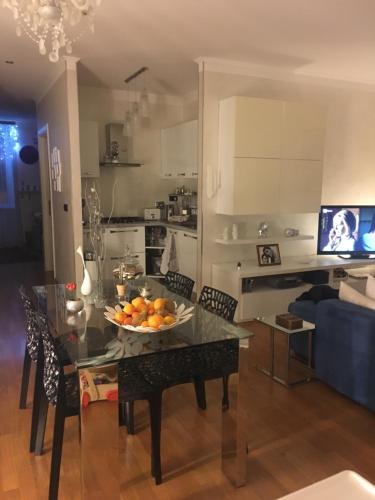 a kitchen with a table with a bowl of fruit on it at B&B Borgo Marina in Bordighera