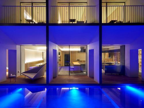 a collage of photos of a house with a swimming pool at Garden Terrace Saga Hotel & Resorts in Saga