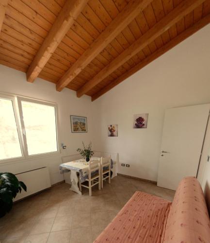 a living room with a table and a window at B&B Al Tardino in Sogliano al Rubicone