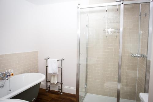 a bathroom with a shower and a toilet and a sink at The Fox in Winchester