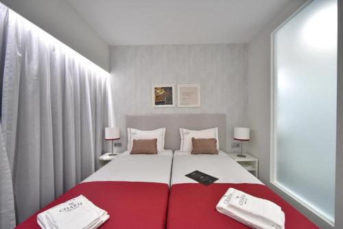 My Charm Lisbon Suitesにあるベッド