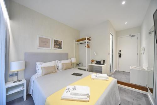 My Charm Lisbon Suitesにあるベッド
