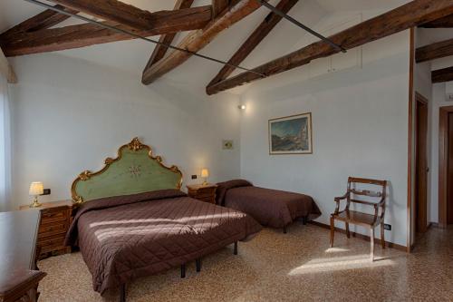 Ένα ή περισσότερα κρεβάτια σε δωμάτιο στο Hotel Guerrato