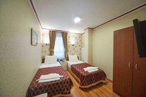 
Un ou plusieurs lits dans un hébergement de l'établissement Hotel Akcinar
