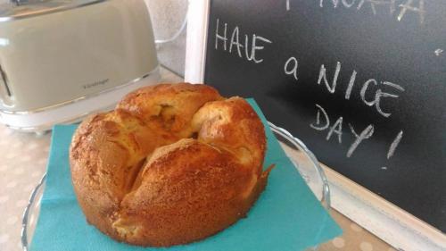 a pastry sitting on a blue napkin next to a chalkboard at La Terrazza sul Naviglio B&B in Bernate Ticino
