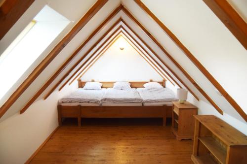 Postel nebo postele na pokoji v ubytování Bučický mlýn