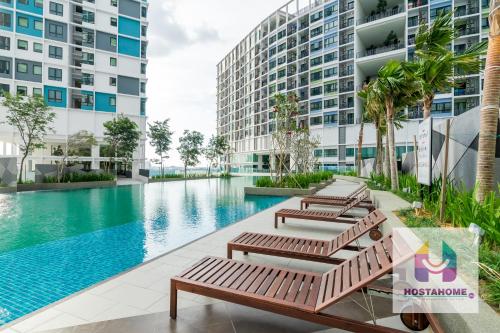 an image of a swimming pool in a building at HostaHome Suites at I-City, Central Mall in Shah Alam