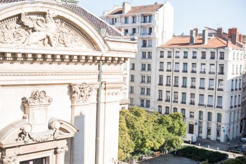 a view of the facade of a building at Hôtel Des Artistes in Lyon