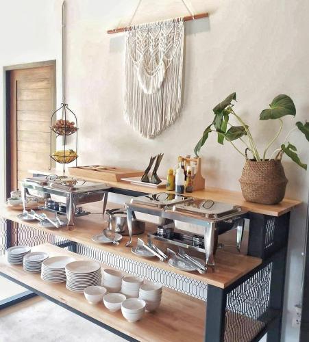 a kitchen with a counter with pots and pans at Casa Foresta Nan in Nan