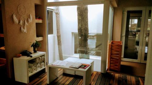 a small room with a window and a table and a table sidx sidx at Jaina Resort & Spa in Mar de las Pampas