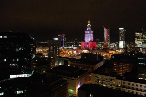 a view of a city at night at Hotel Warszawa in Warsaw