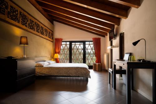 Postel nebo postele na pokoji v ubytování Agriturismo Sommavalle