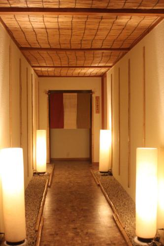a hallway with three lights in a building at Mount View Hakone in Hakone