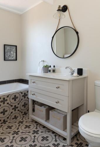 a bathroom with a sink and a toilet at Le Vine Constantia in Cape Town