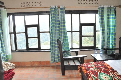 Postel nebo postele na pokoji v ubytování Nyungwe Nziza Ecolodge