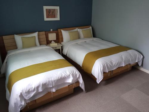 Cama o camas de una habitación en Hotel Gaon J Stay