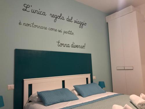 Postel nebo postele na pokoji v ubytování Dormi a Roma