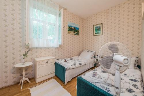 Giường trong phòng chung tại Villa Emilia