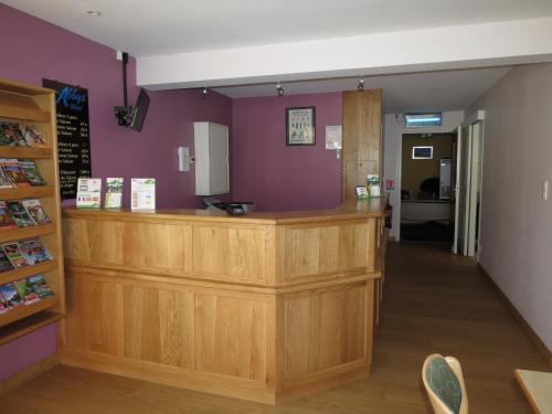 a shop with a counter in a room at Abbys Hotel in Sarlat-la-Canéda