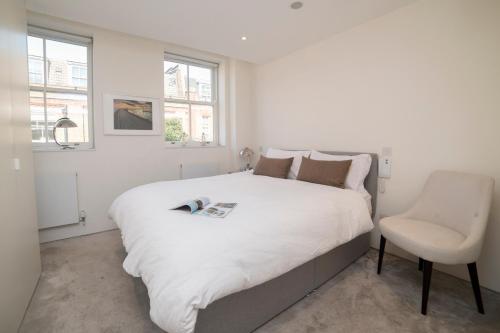 מיטה או מיטות בחדר ב-Stunning 2 Bedroom Duplex Apartment - Oxford Circus