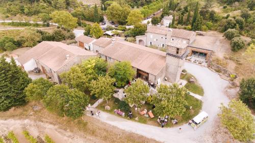 an overhead view of a house with a group of people in front of it at Domaine Calmel & Joseph in Montirat