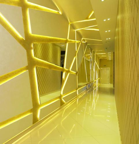 a hallway of a building with yellow lights at MELISS EVENTS in Craiova