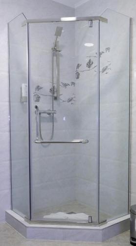a shower with a glass door in a bathroom at MELISS EVENTS in Craiova