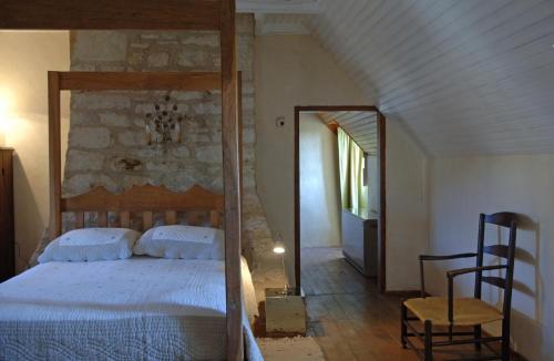 Postel nebo postele na pokoji v ubytování LES HAUTS DU CAUSSE
