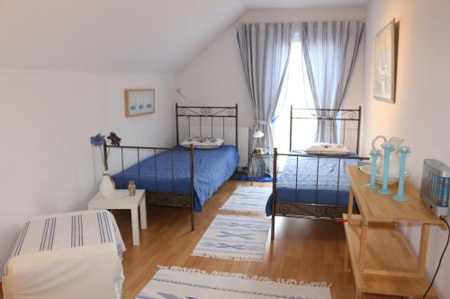 Postel nebo postele na pokoji v ubytování Ferienhaus am Yachthafen