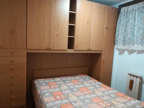 Ένα ή περισσότερα κρεβάτια σε δωμάτιο στο Valsassina Rent